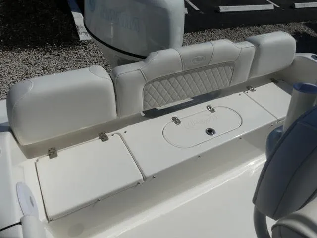 Slide: The Image of 2025 Key West 189 FS boat interior with cushioned seating and storage compartments. - 10