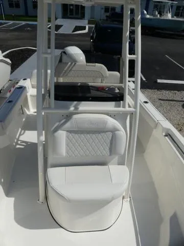 Slide: The Image of 2025 Key West 189 FS boat interior with white seating and center console. - 13