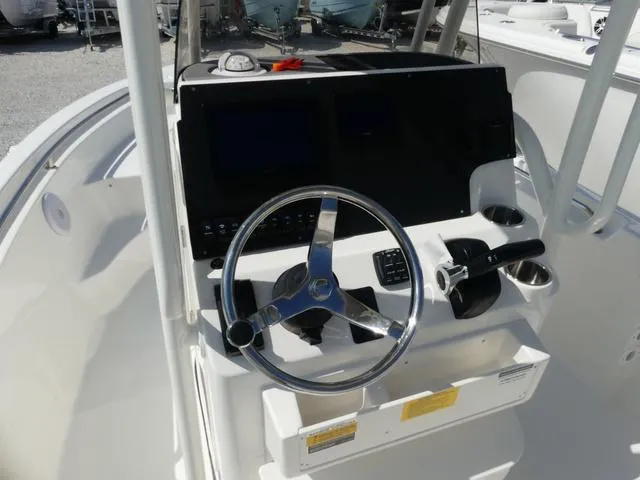 Slide: The Image of 2025 Key West 189 FS boat console with steering wheel and controls. - 5