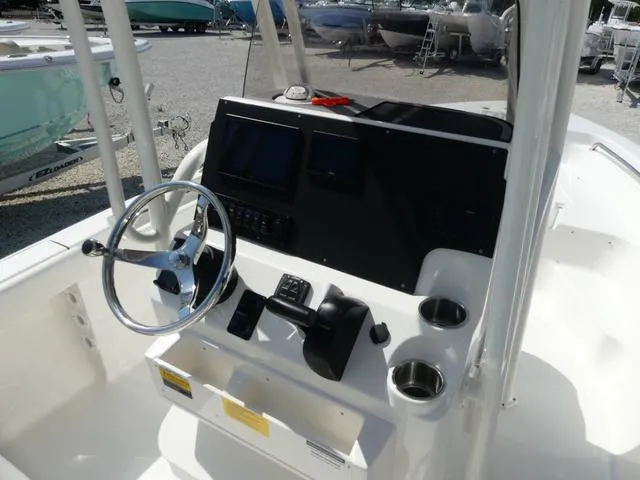 Slide: The Image of 2025 Key West 189 FS boat console with steering wheel and controls. - 7