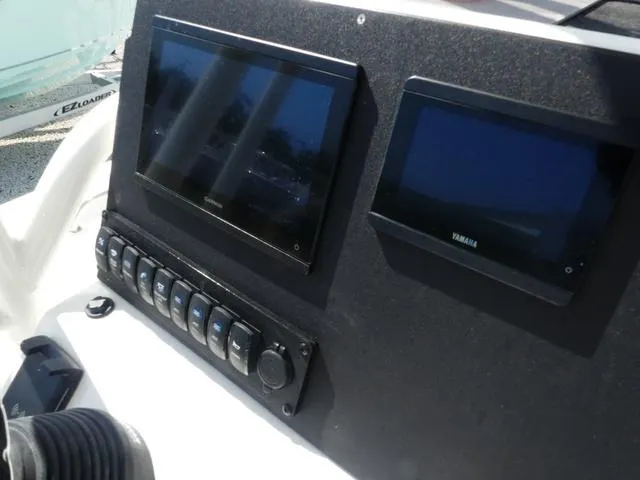 Slide: The Image of Dashboard of 2025 Key West 189 FS boat with dual screens and control panel. - 8