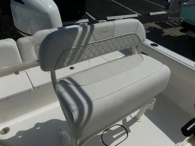 Slide: The Image of 2025 Key West 189 FS boat seat with white cushioned upholstery and diamond pattern stitching. - 9