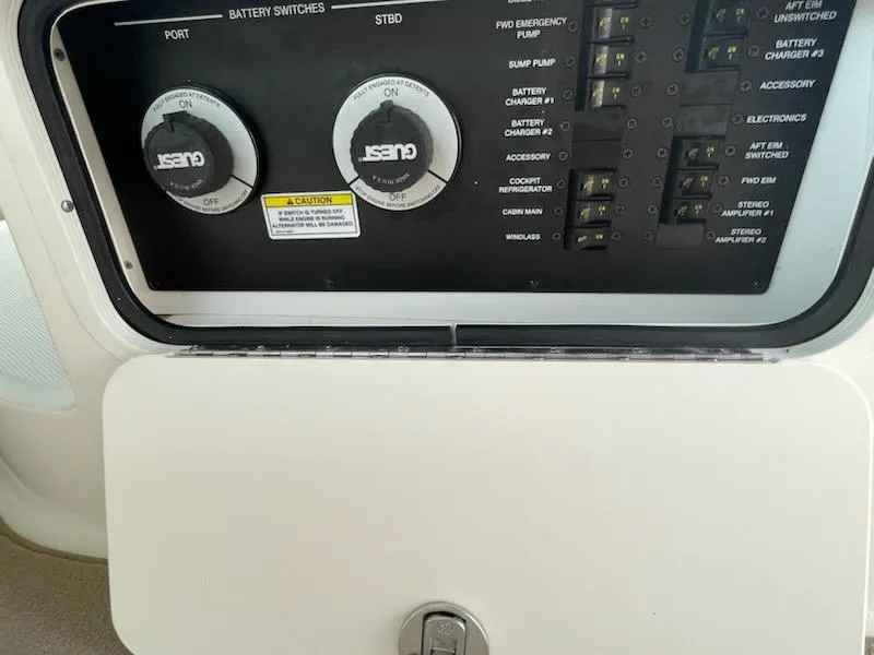 Slide: The Image of Control panel of a 2007 Sea Ray 310 Sundancer boat with battery switches. - 16