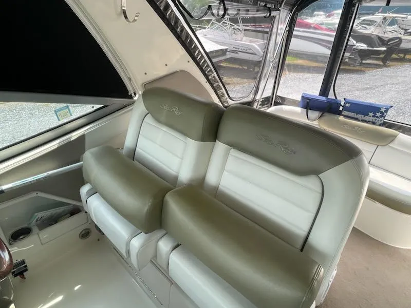 Slide: The Image of 2007 Sea Ray 310 Sundancer interior with beige and white seating. - 17