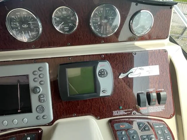 Slide: The Image of Dashboard of a 2007 Sea Ray 310 Sundancer boat with gauges and controls. - 24