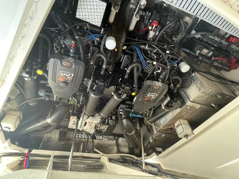 Slide: The Image of Engine compartment of a 2007 Sea Ray 310 Sundancer, featuring twin 350 MAG engines. - 25