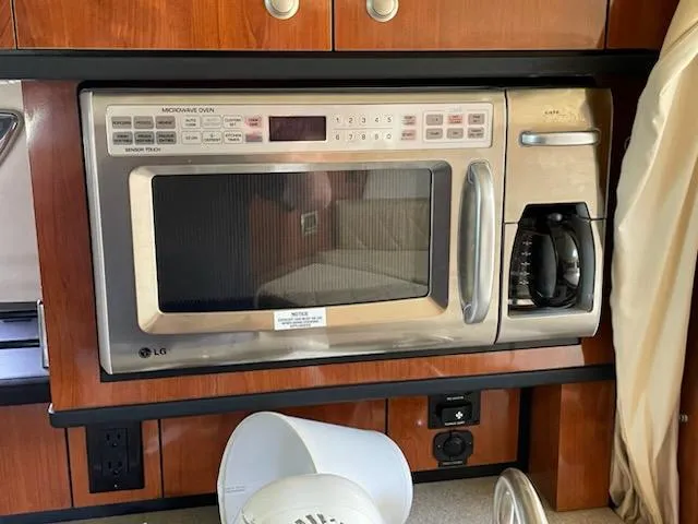 Slide: The Image of Microwave and coffee maker in 2007 Sea Ray 310 Sundancer yacht kitchen. - 30