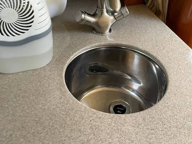 Slide: The Image of Stainless steel sink on 2007 Sea Ray 310 Sundancer boat with modern faucet. - 31