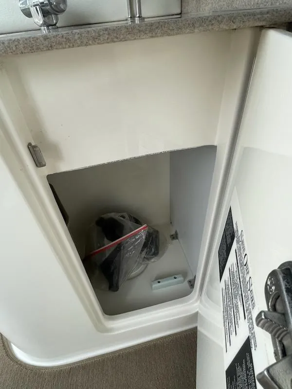 Slide: The Image of 2007 Sea Ray 310 Sundancer cabinet interior with storage space. - 9