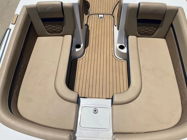 Slide: The Image of 2020 Hurricane SS218 boat interior with beige seating and wooden flooring. - 10
