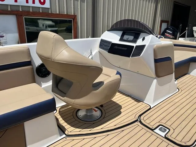 Slide: The Image of 2020 Hurricane SS218 boat interior with tan seating and modern dashboard design. - 17