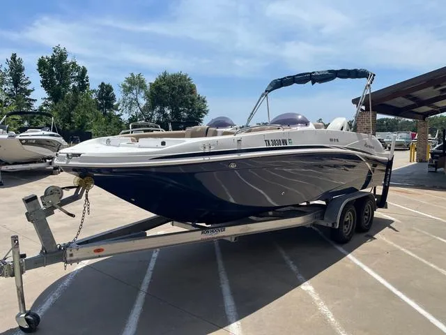 Slide: The Image of 2020 Hurricane SS218 boat on trailer in sunny outdoor setting. - 4