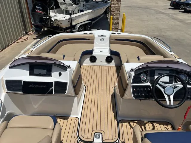 Slide: The Image of 2020 Hurricane SS218 boat interior with steering wheel and seating. - 5