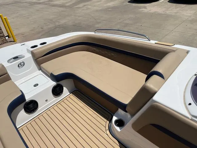 Slide: The Image of 2020 Hurricane SS218 boat interior with beige seating and wood-style flooring. - 8