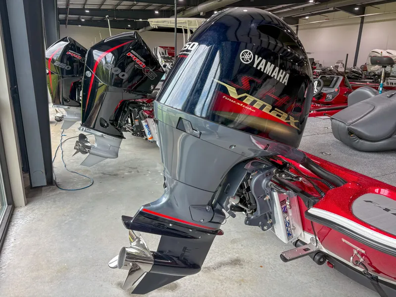 Slide: The Image of Yamaha outboard motors on Falcon F185 boats, 2023 model, in a showroom setting. - 10