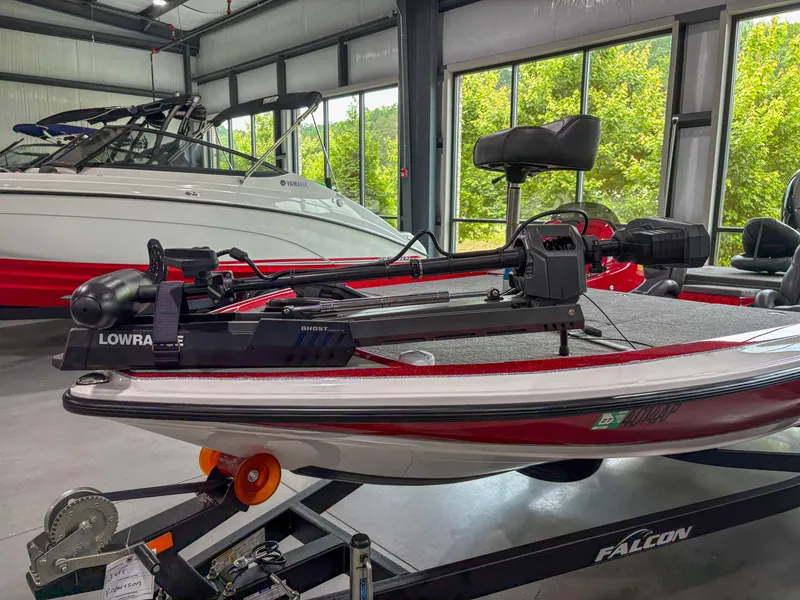 Slide: The Image of 2023 Falcon F185 boat in showroom, featuring advanced Lowrance equipment. - 4