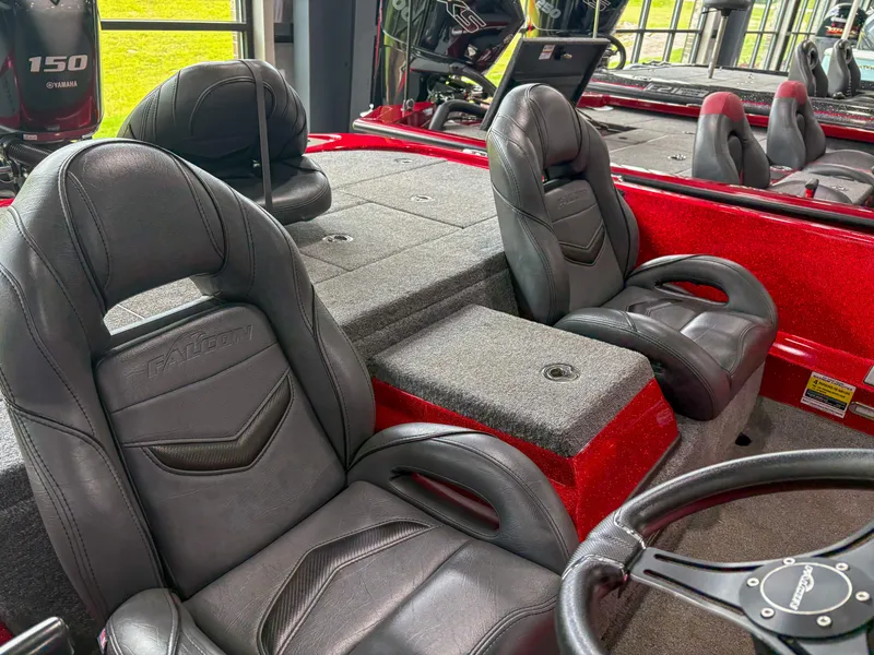 Slide: The Image of Interior of 2023 Falcon F185 boat with black leather seats and red accents. - 6