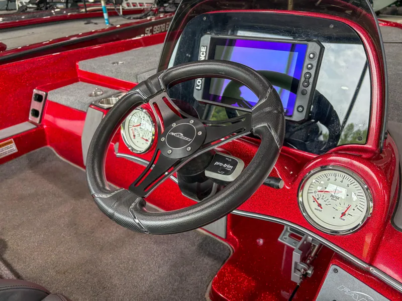 Slide: The Image of Steering wheel and dashboard of 2023 Falcon F185 boat with digital display and gauges. - 7