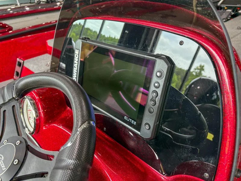 Slide: The Image of Red Falcon F185 boat dashboard with steering wheel and Lowrance Elite fishfinder, 2023 model. - 8