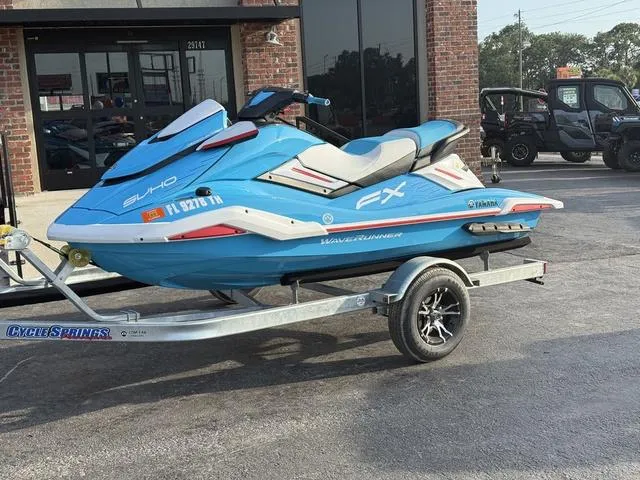 Slide: The Image of 2022 Yamaha Marine Waverunner FX on trailer, parked outside a brick building. - 3