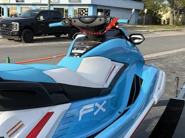 Slide: The Image of 2022 Yamaha Marine Waverunner FX in blue, parked on a trailer near a street. - 7