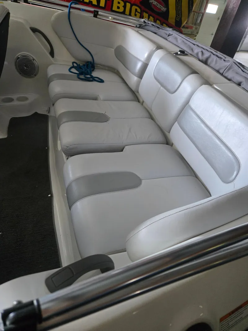 Slide: The Image of 2008 Sea-Doo 180 Challenger boat interior with white leather seating and blue rope. - 6
