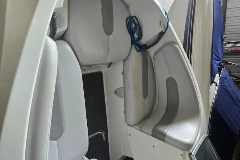 Slide: The Image of 2008 Sea-Doo 180 Challenger boat interior with white and gray seating. - 7
