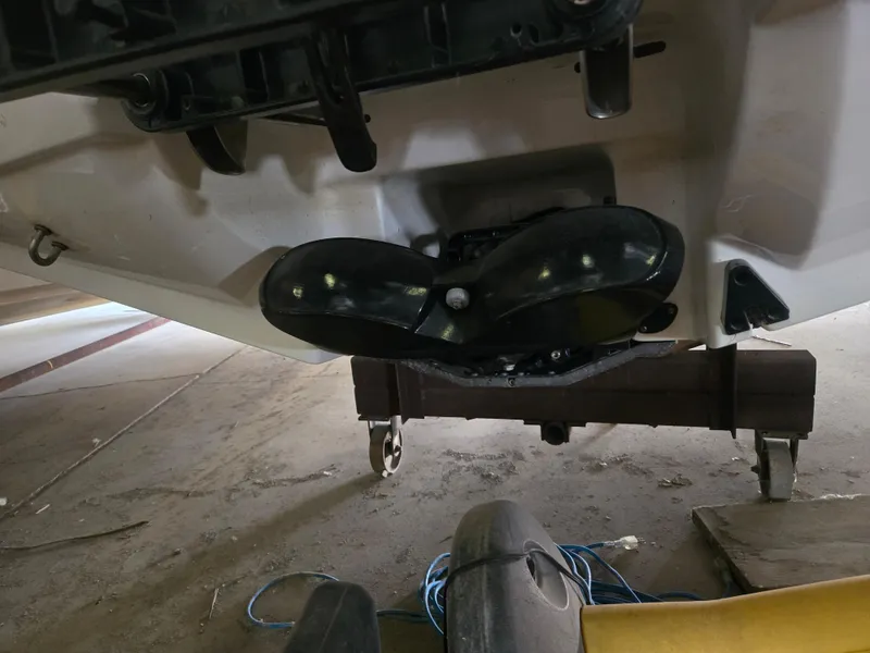 Slide: The Image of 2008 Sea-Doo 180 Challenger boat underside view in a garage setting. - 9