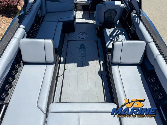 Slide: The Image of 2023 Axis Wake Research T250 boat interior with spacious seating and modern design. - 10
