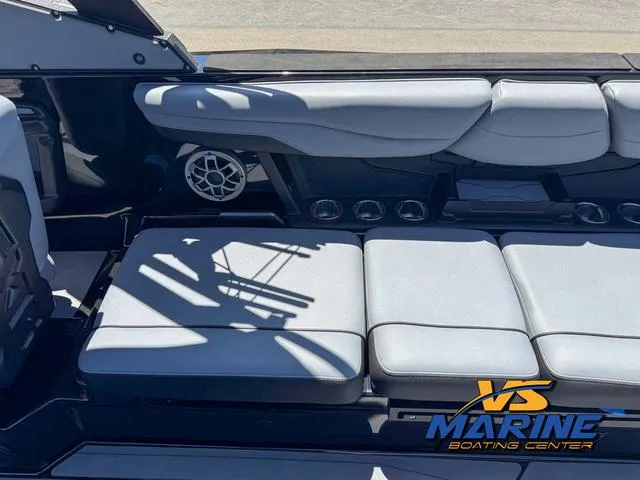 Slide: The Image of 2023 Axis Wake Research T250 boat interior with cushioned seating and speaker system. - 14