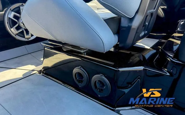Slide: The Image of 2023 Axis Wake Research T250 boat interior with sleek seating and speaker system. - 16