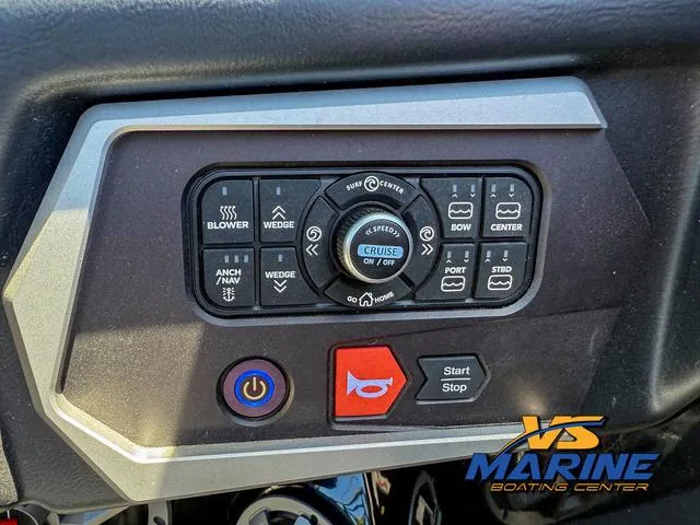 Slide: The Image of 2023 Axis Wake Research T250 control panel with various boat function buttons. - 18