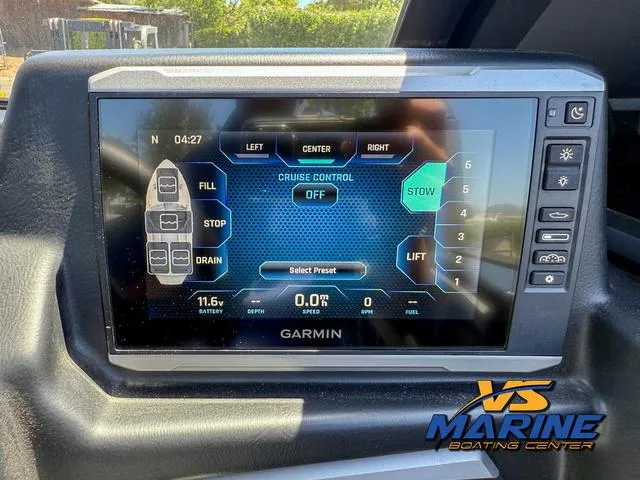 Slide: The Image of Garmin display in 2023 Axis Wake Research T250 boat, showing cruise control and settings. - 19