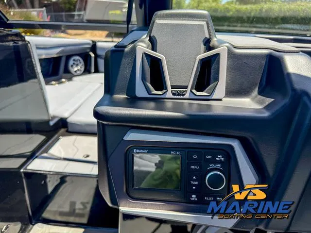 Slide: The Image of 2023 Axis Wake Research T250 boat dashboard with Bluetooth stereo system at VS Marine Boating Center. - 20