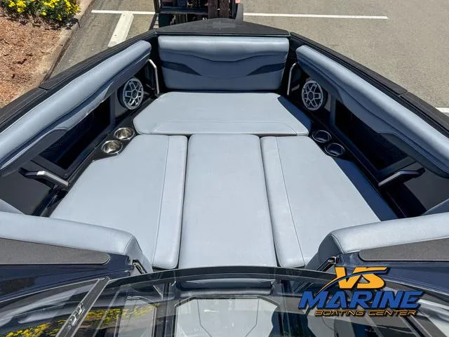 Slide: The Image of 2023 Axis Wake Research T250 boat interior with gray seating and cup holders. - 22