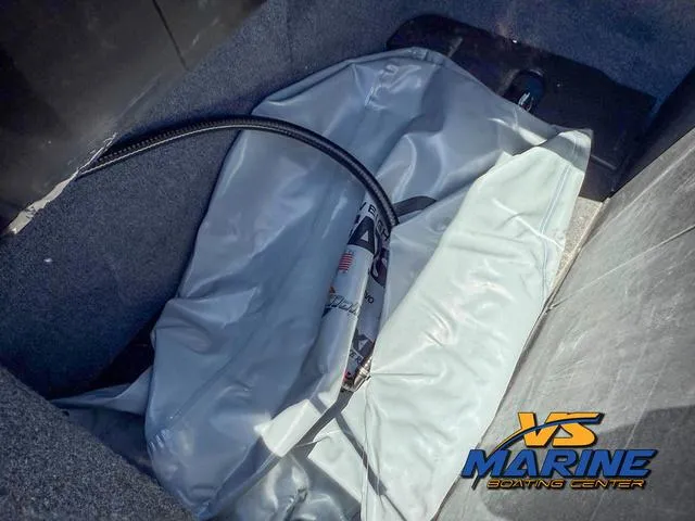 Slide: The Image of 2023 Axis Wake Research T250 boat ballast bag in storage compartment. - 24