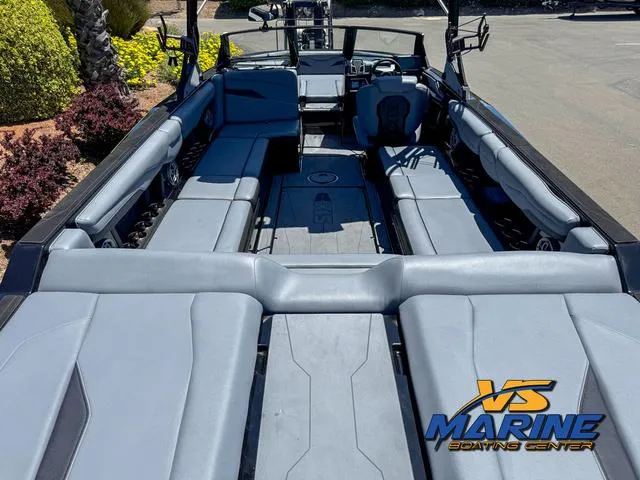Slide: The Image of 2023 Axis Wake Research T250 boat interior with spacious seating and modern design. - 8