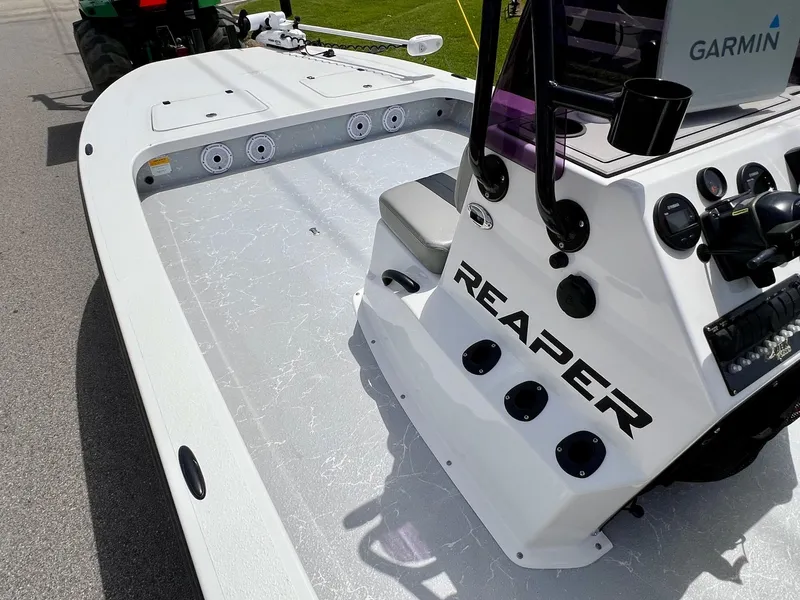 Slide: The Image of 2021 Majek REAPER boat with Garmin equipment, featuring a spacious deck and modern design. - 12