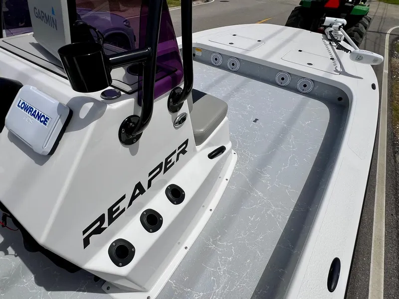 Slide: The Image of 2021 Majek REAPER boat deck with Garmin and Lowrance equipment. - 14