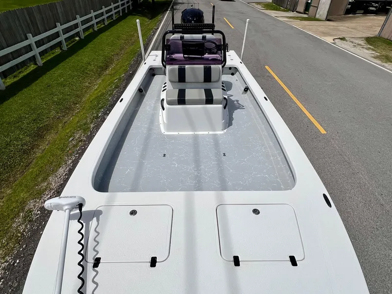 Slide: The Image of 2021 Majek REAPER boat on road, featuring spacious deck and dual storage compartments. - 15