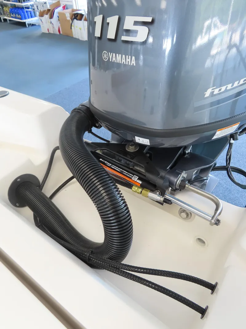 Slide: The Image of 2025 Key West 179 FS boat with Yamaha 115 outboard motor, close-up view. - 18