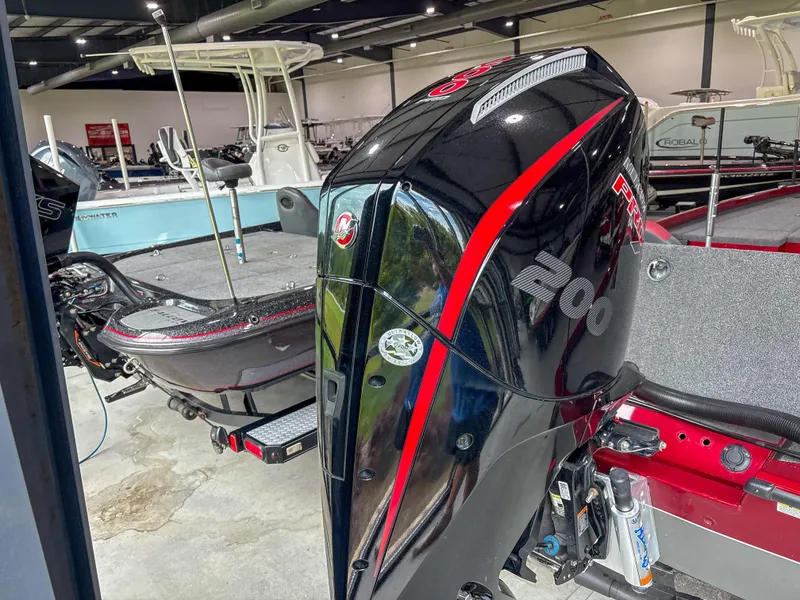 Slide: The Image of 2022 Vexus AVX 2080 boat with powerful 200 HP outboard motor in showroom. - 11