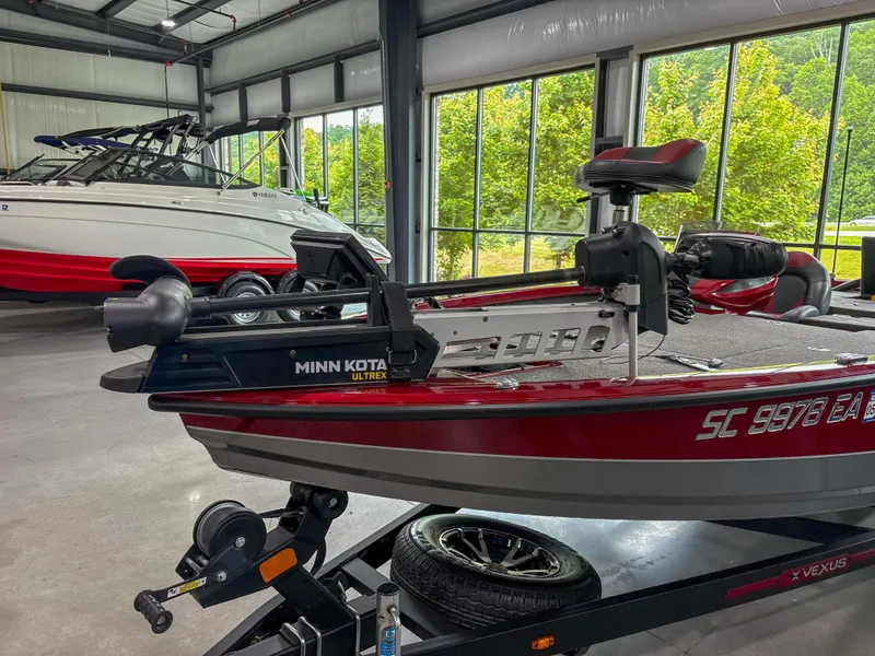Slide: The Image of 2022 Vexus AVX 2080 boat with Minn Kota motor in a showroom. - 5