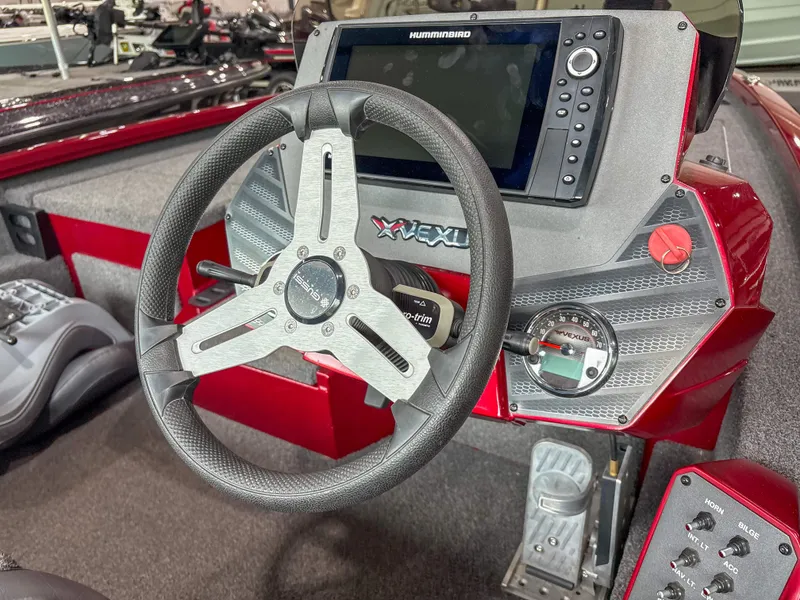 Slide: The Image of 2022 Vexus AVX 2080 boat dashboard with steering wheel and Humminbird display. - 7