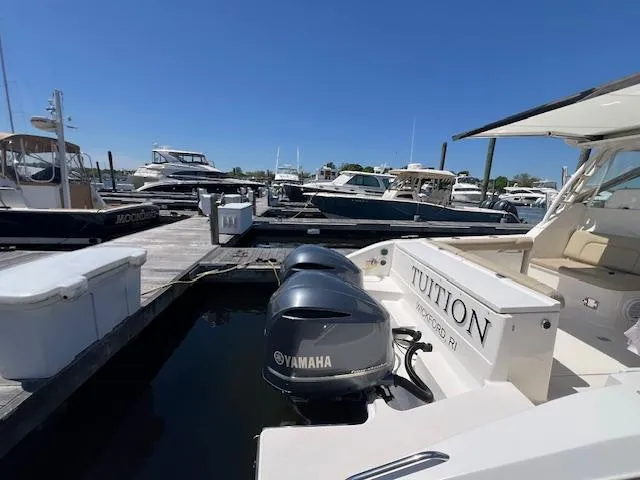 Slide: The Image of 2017 Pursuit DC 325 Dual Console boat docked with Yamaha outboard engine. - 11