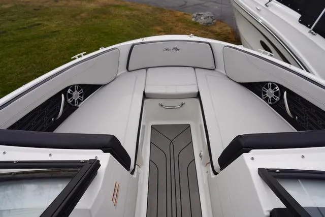 Slide: The Image of 2024 Sea Ray SPX 210 boat interior with sleek seating and modern design. - 15