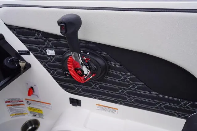 Slide: The Image of 2024 Sea Ray SPX 210 boat throttle control with stylish interior design. - 23
