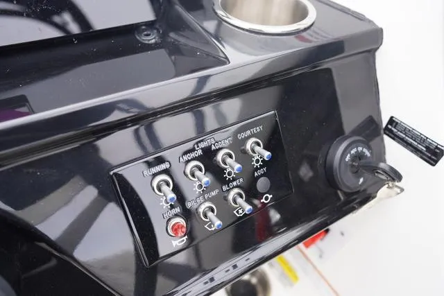 Slide: The Image of Control panel of 2024 Sea Ray SPX 210 boat with switches and ignition. - 27