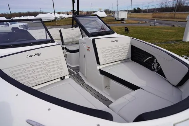Slide: The Image of 2024 Sea Ray SPX 210 boat interior with sleek white seating and modern design. - 3