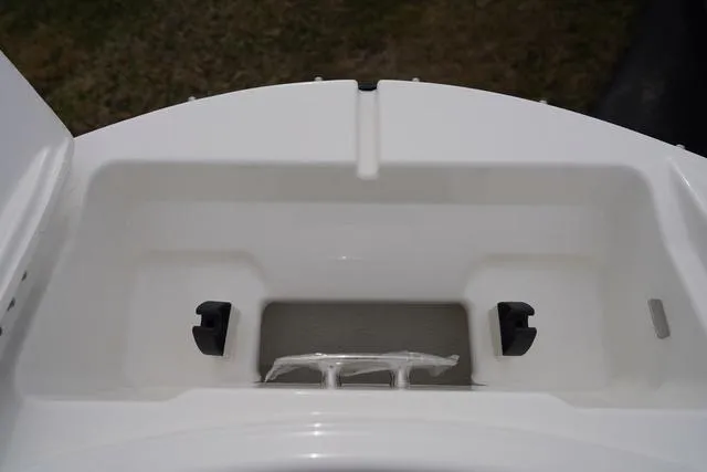 Slide: The Image of 2024 Sea Ray SPX 210 storage compartment, open and empty, showcasing interior design. - 30